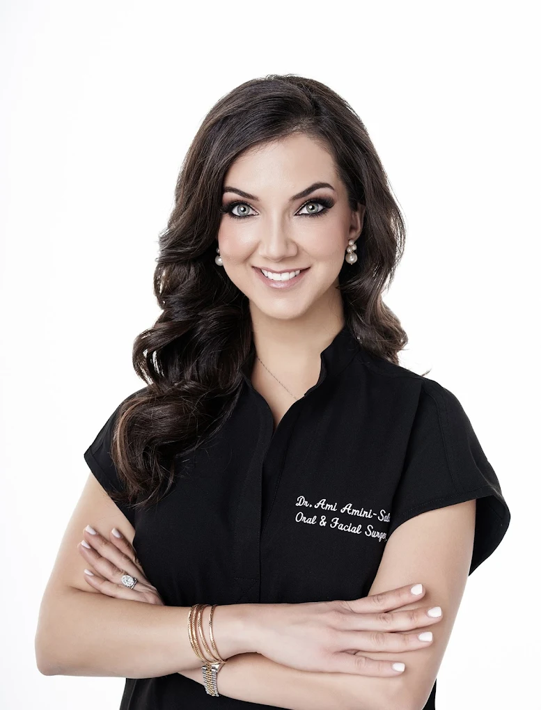 Professional portrait of Dr. Ami Amini-Salari in black clinical attire